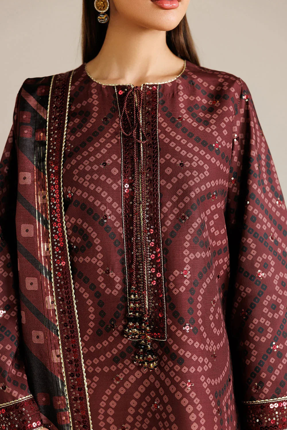 Elegant maroon kurta with geometric patterns and sequin embroidery for festive occasions