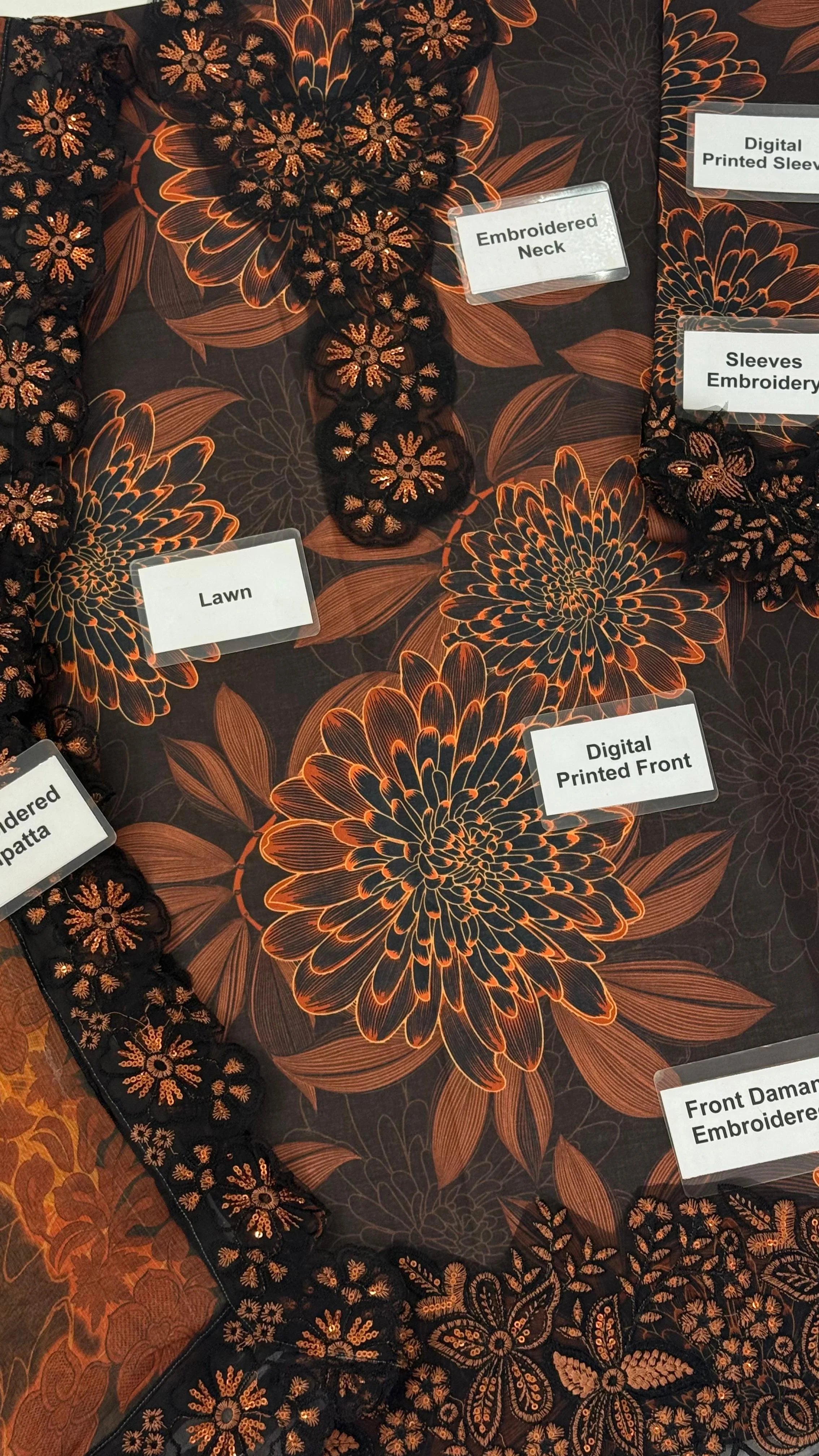 Black and copper floral dress with embroidered neck, sleeves, and digital printed front details