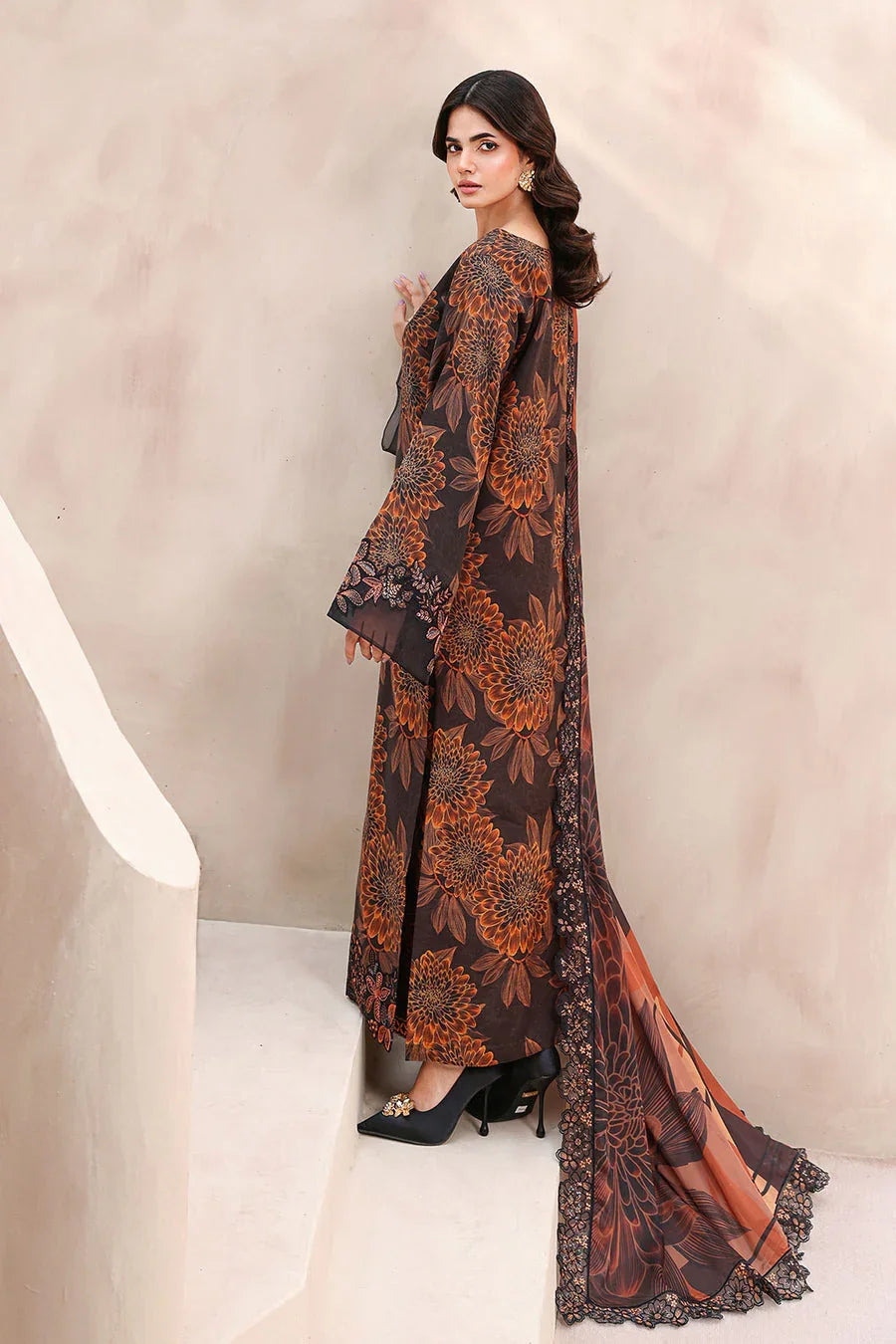 Elegant black and orange floral print maxi dress with lace trim and flared sleeves