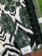Daman embroidered dress with green floral lace on black and white ikat print fabric