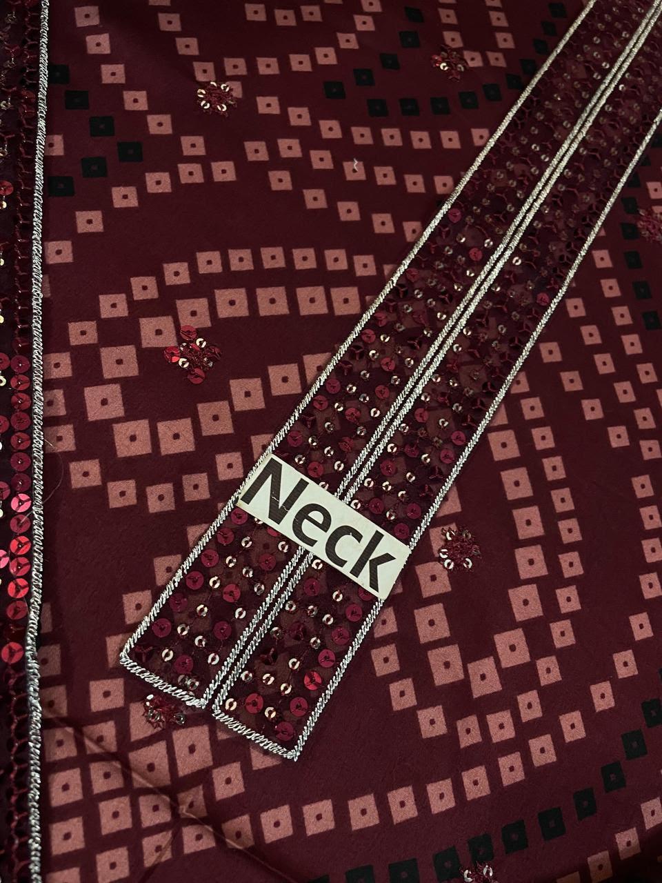 Elegant maroon fabric with geometric patterns and sequin embellishments, labeled 'Neck'