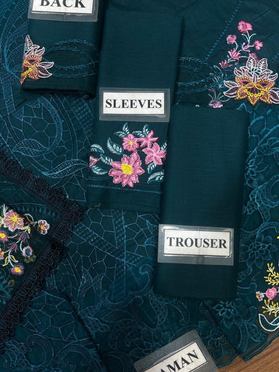 Dark green embroidered dress set with floral sleeves, back, and trouser pieces, lace detailing