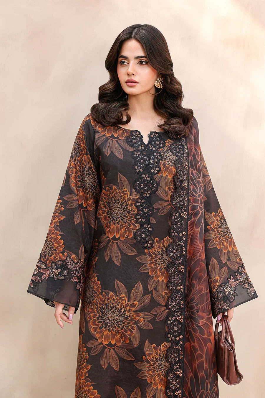 Black and rust floral printed kurta with lace detailing and bell sleeves, styled with a brown handbag