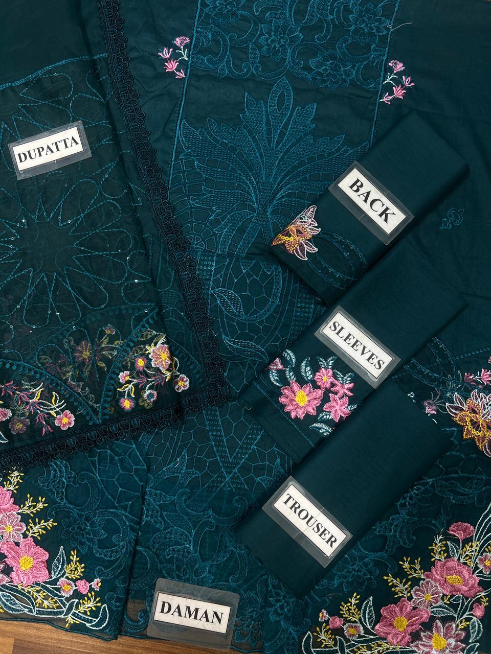 Teal embroidered suit set with floral dupatta, back, sleeves, trouser, and daman labels