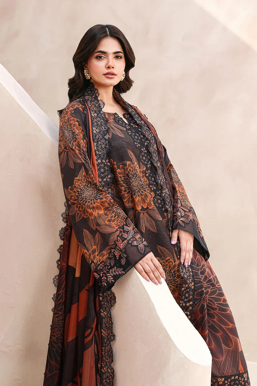 Elegant black and rust floral printed chiffon dress with lace detailing, perfect for festive occasions.