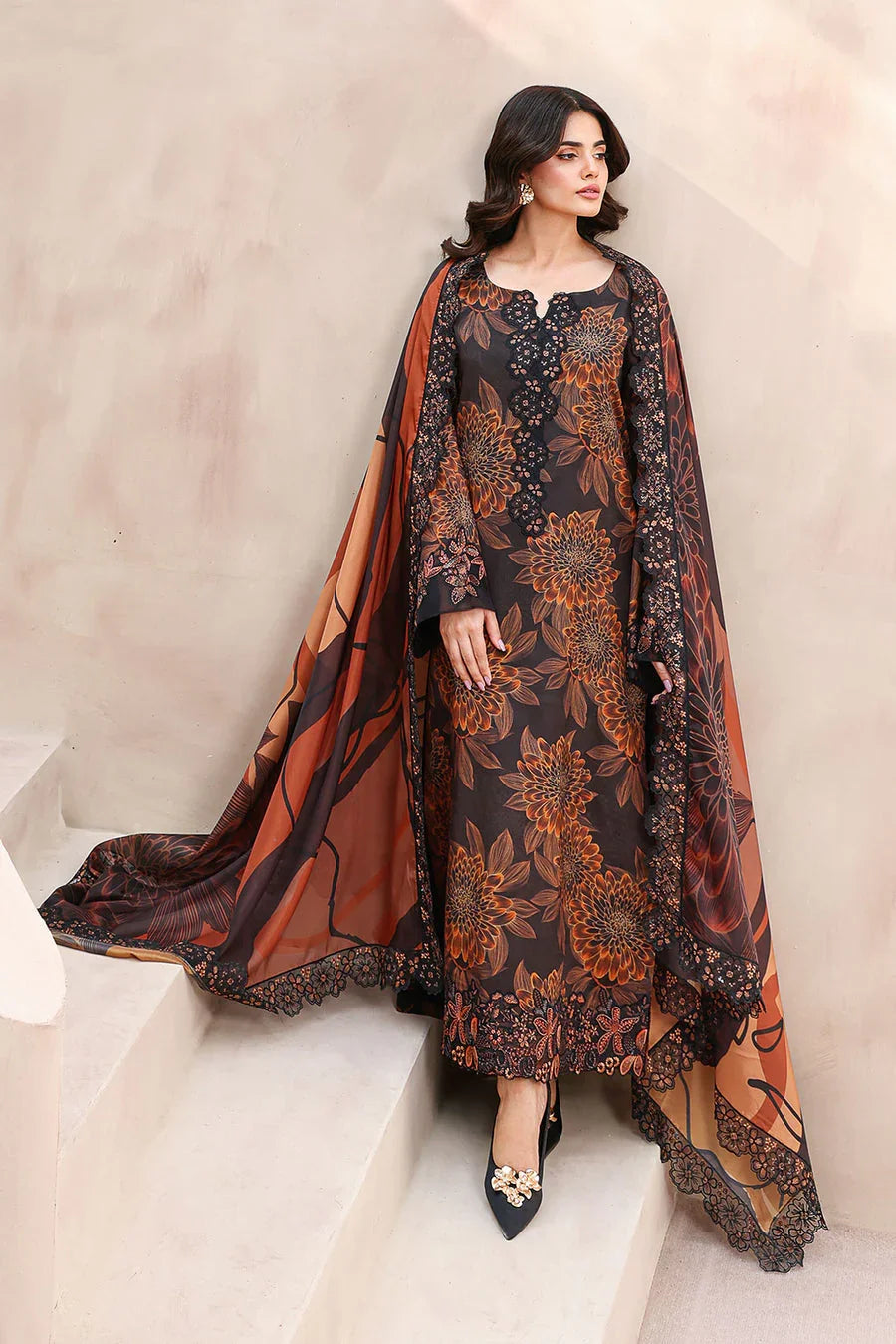 Elegant black and rust floral printed dress with lace detailing and matching dupatta, styled with heels.