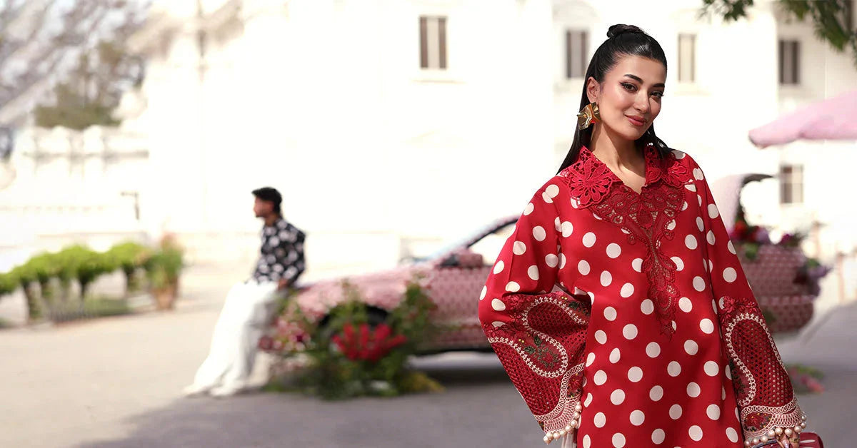 Red polka dot dress with lace detailing, elegant outdoor fashion