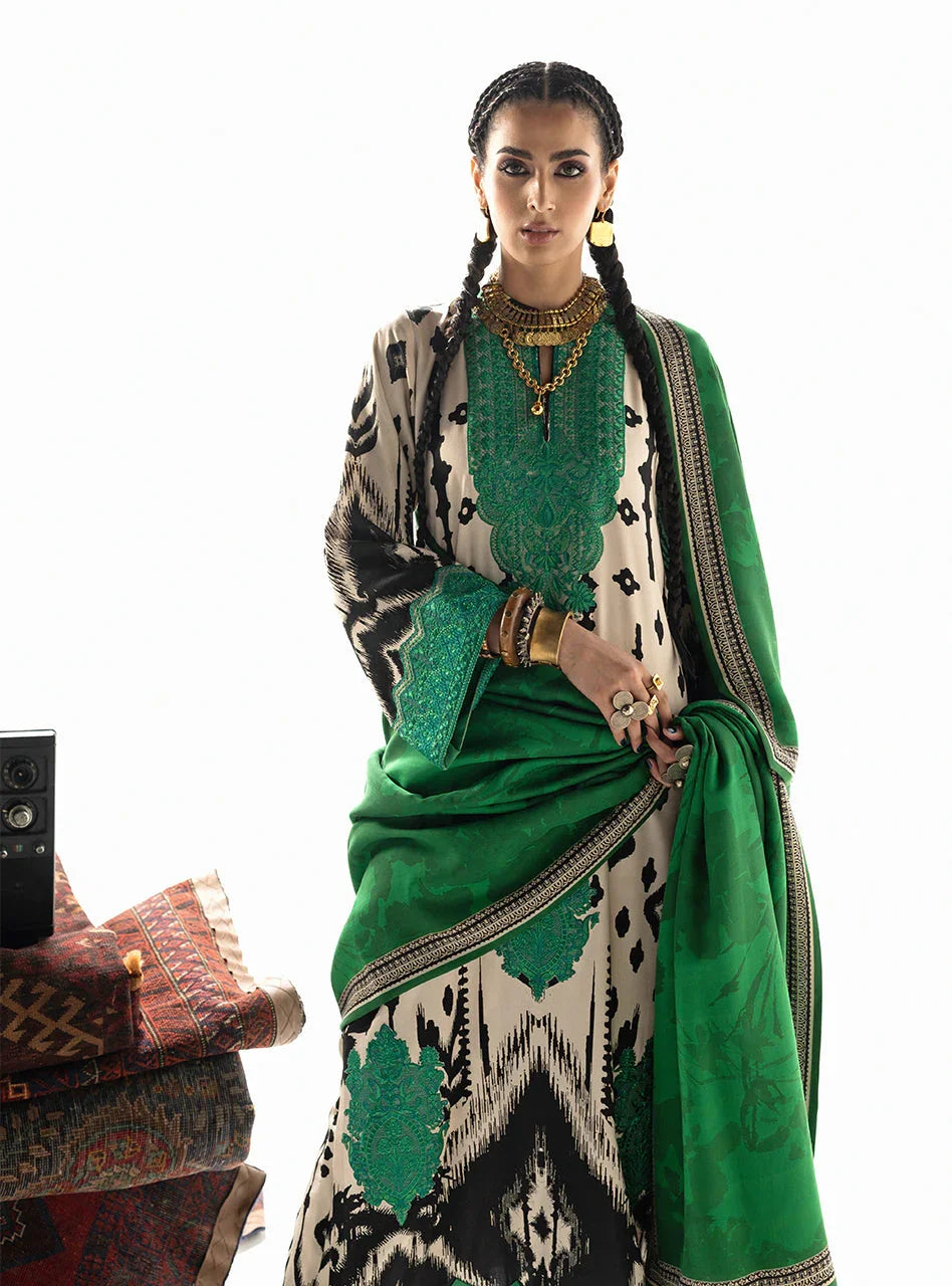 Elegant green and black embroidered traditional outfit with matching dupatta and gold jewelry
