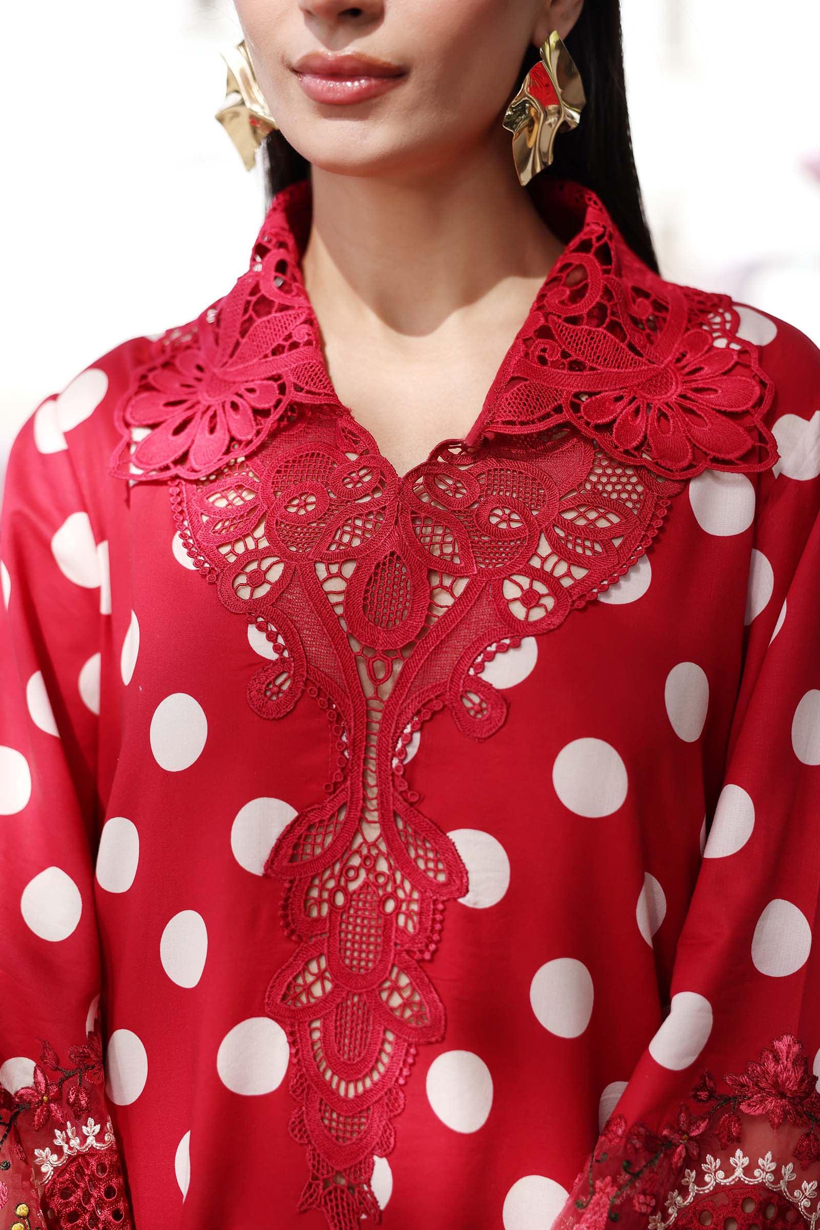 Red polka dot dress with intricate lace collar and floral embroidery details