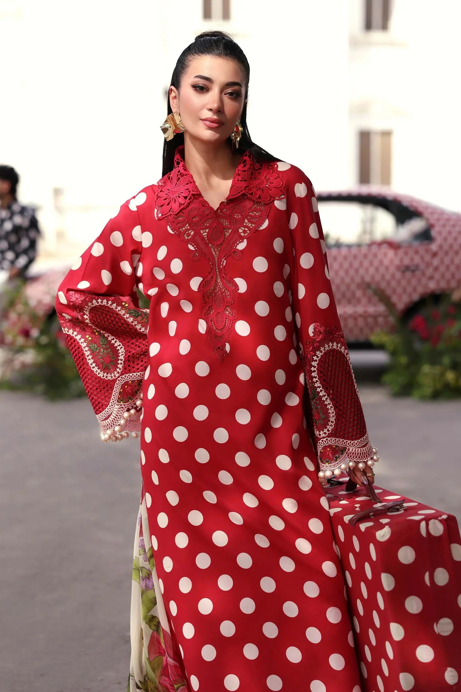 Red polka dot dress with lace detailing and floral embroidery