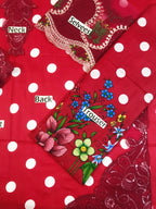 Red polka dot dress with floral print, lace sleeves, and labeled parts for neck, back, and trouser sections.